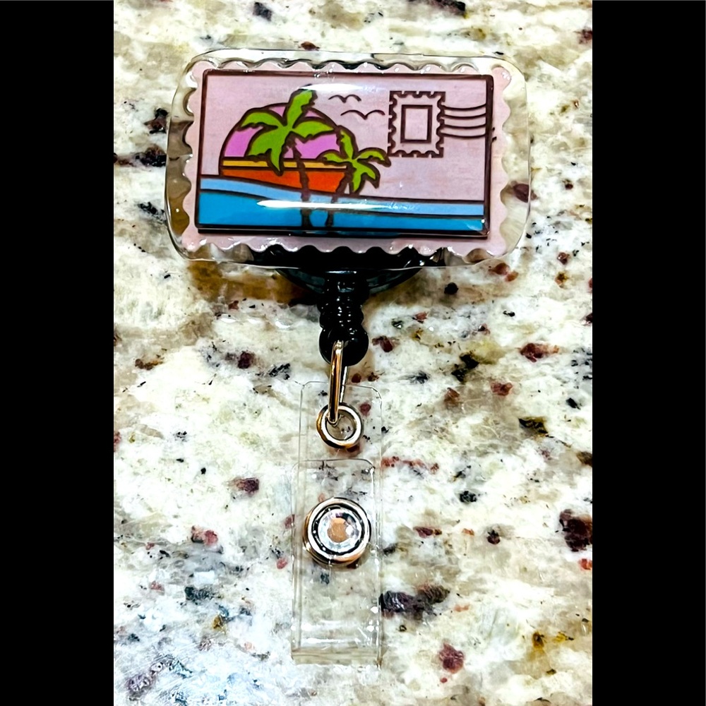 Postcard badge reel. Badge pull.